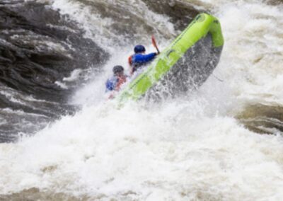 Overnight Trips 8 Zoo Town Surfers raft navigating whitewater on a half-day Lochsa River rafting trip.