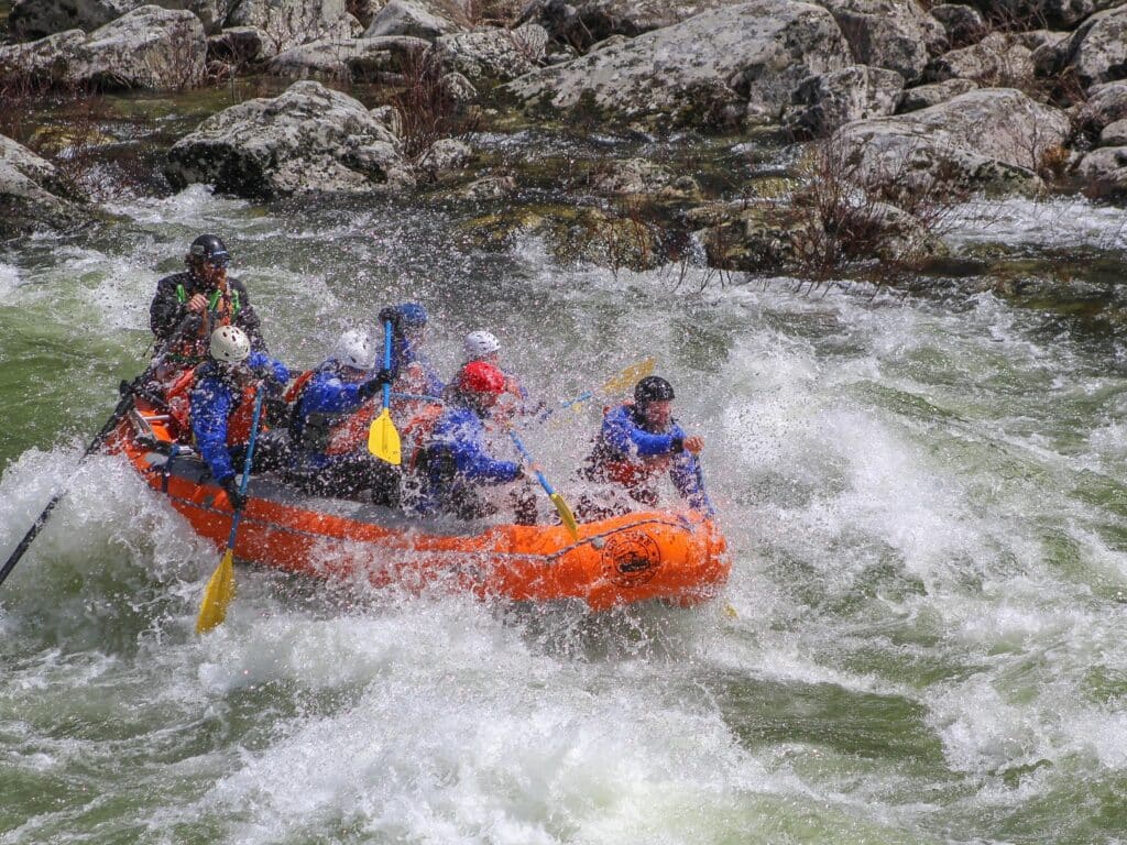 Lochsa rafting trips in 2025 paddling through a rapid