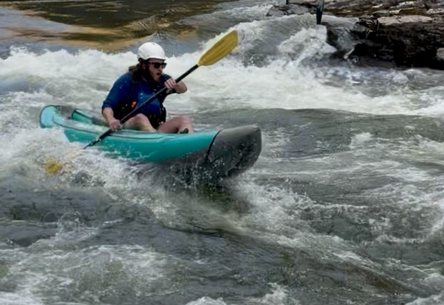 Alberton Gorge Half Day Inflatable Kayaking Kayaker paddling through whitewater rapids on the Alberton Gorge inflatable kayak trip near Missoula, Montana