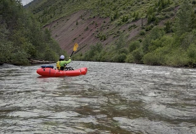 Half Day Guided Packrafting Tarkio Gorge Packrafter paddling a scenic canyon stretch of the Tarkio Gorge on a half day guided packrafting trip near Missoula, Montana